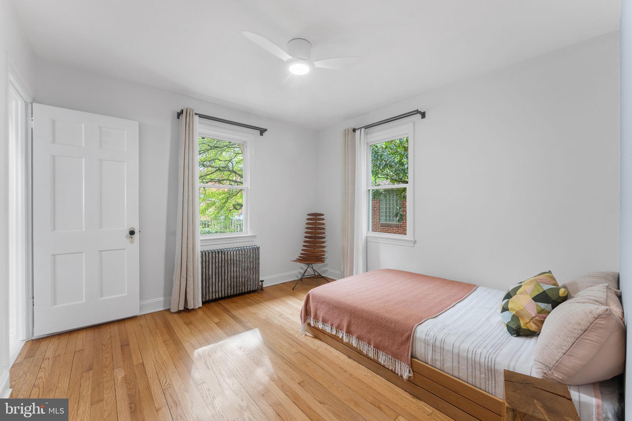 5807 Taylor Road Riverdale, MD 20737 - Photo 21 of 66 a bedroom with a bed and a window