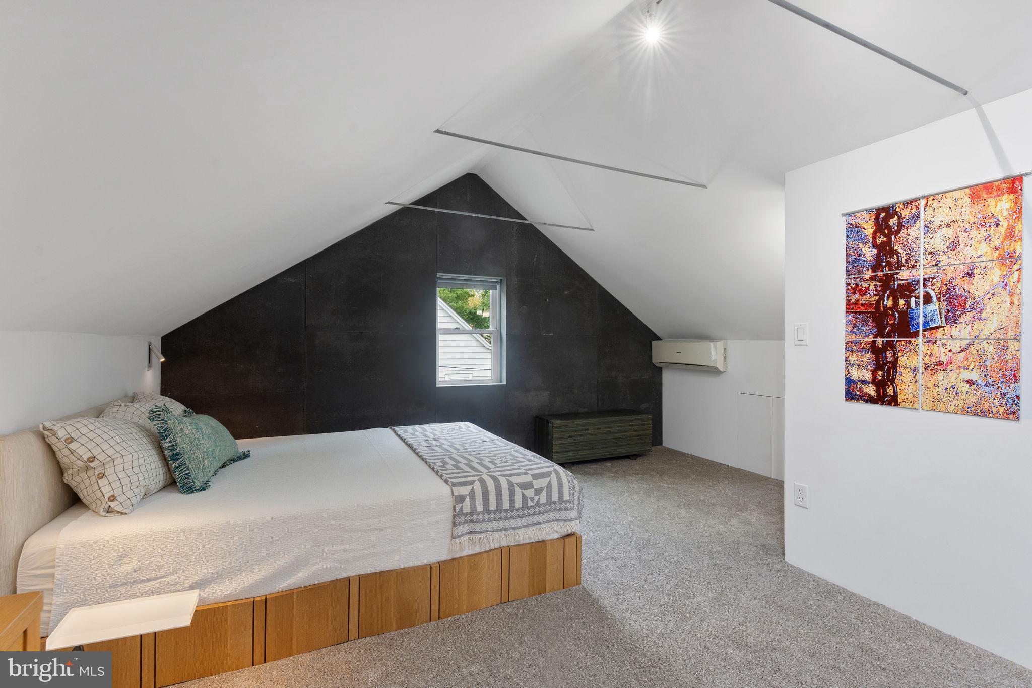 5807 Taylor Road Riverdale, MD 20737 - Photo 29 of 66 a bedroom with a bed and a painting on the wall