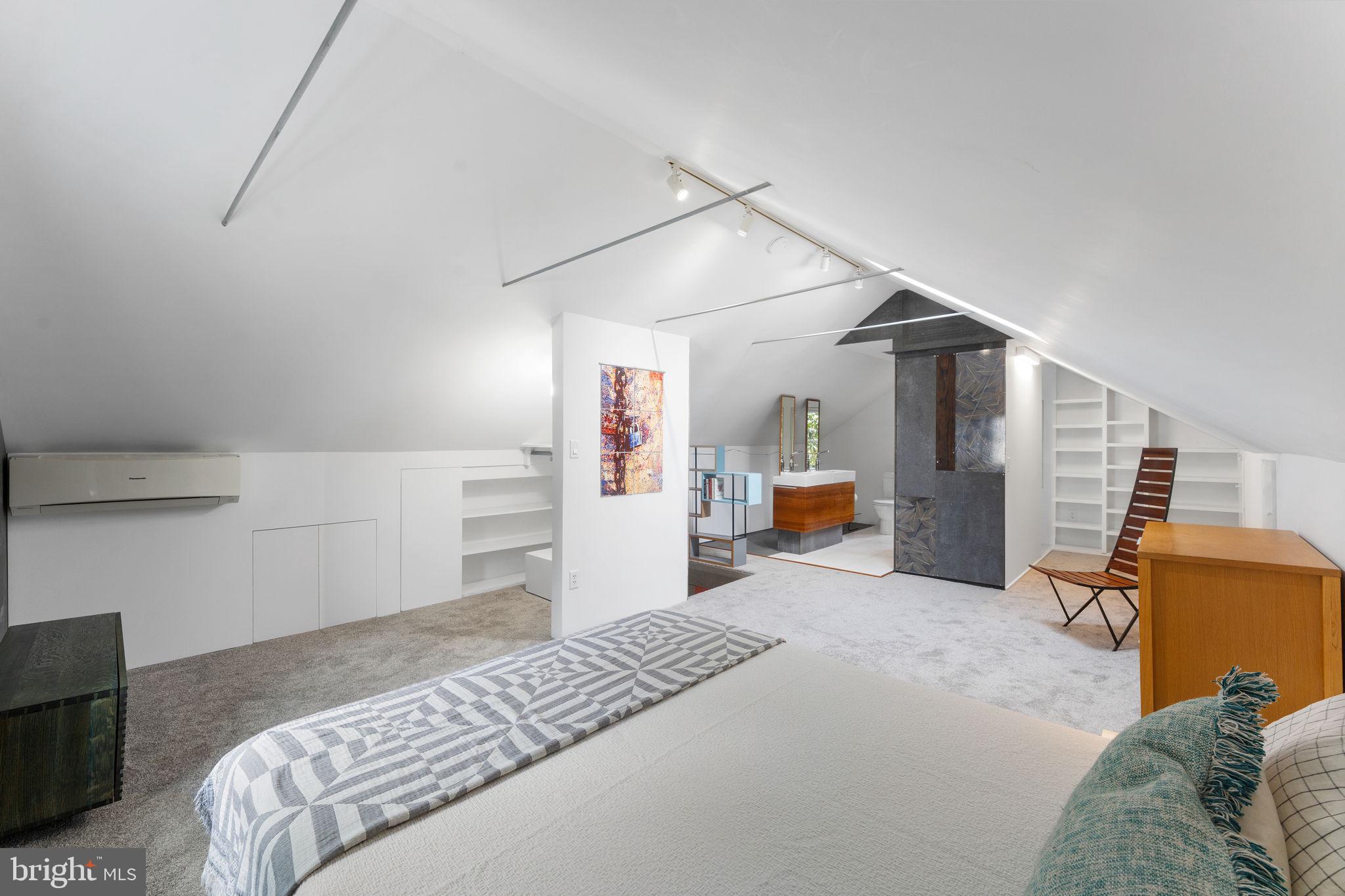 5807 Taylor Road Riverdale, MD 20737 - Photo 31 of 66 a bedroom with bed and cabinets