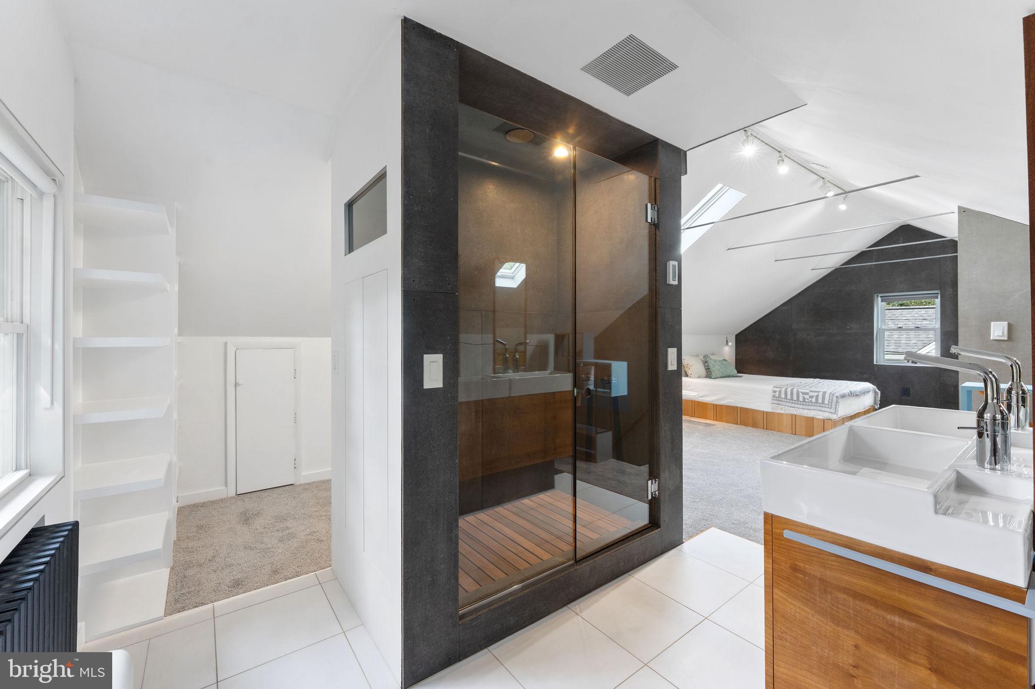 5807 Taylor Road Riverdale, MD 20737 - Photo 35 of 66 a bathroom with a tub and shower