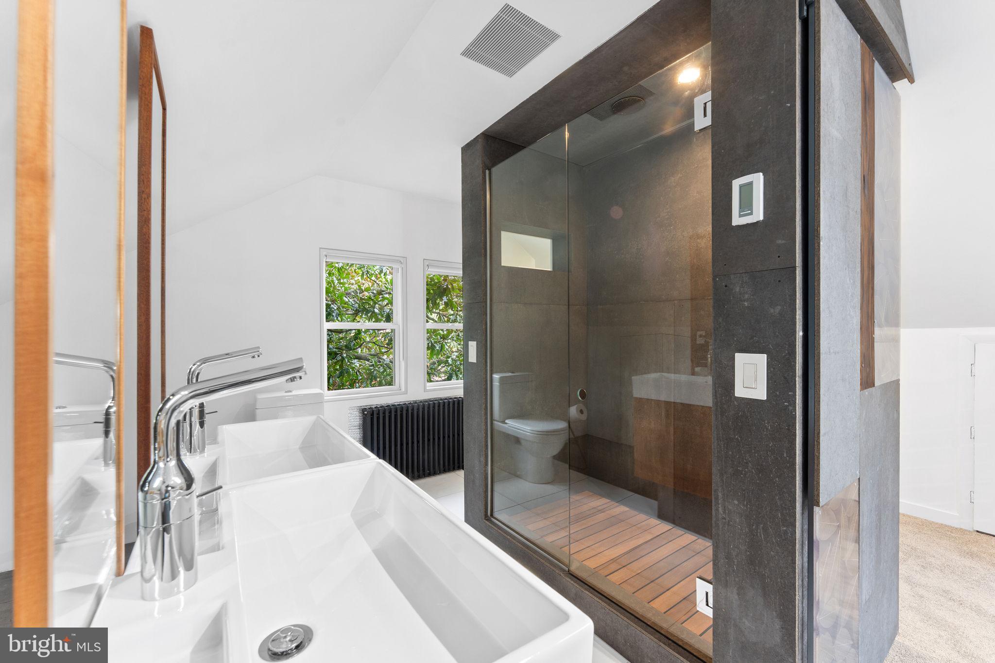 5807 Taylor Road Riverdale, MD 20737 - Photo 36 of 66 a large white tub sitting in a bathroom next to a window