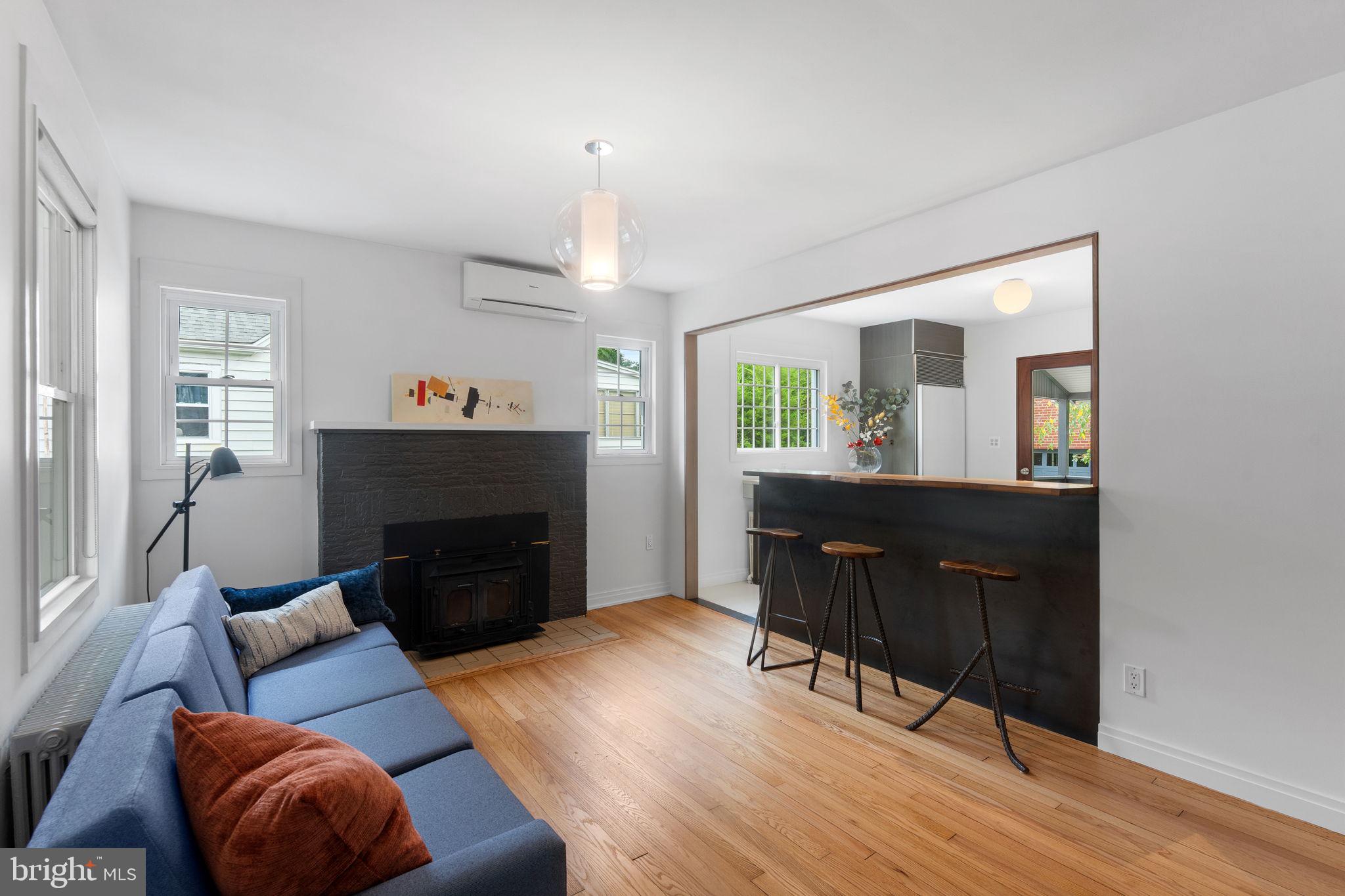 5807 Taylor Road Riverdale, MD 20737 - Photo 8 of 66 a living room with furniture and a fireplace