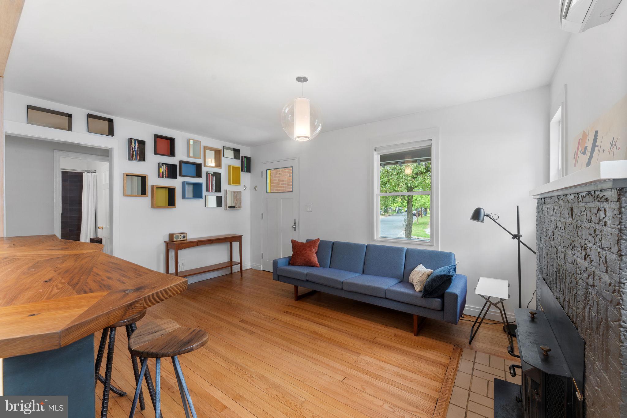 5807 Taylor Road Riverdale, MD 20737 - Photo 9 of 66 a living room with furniture and a window