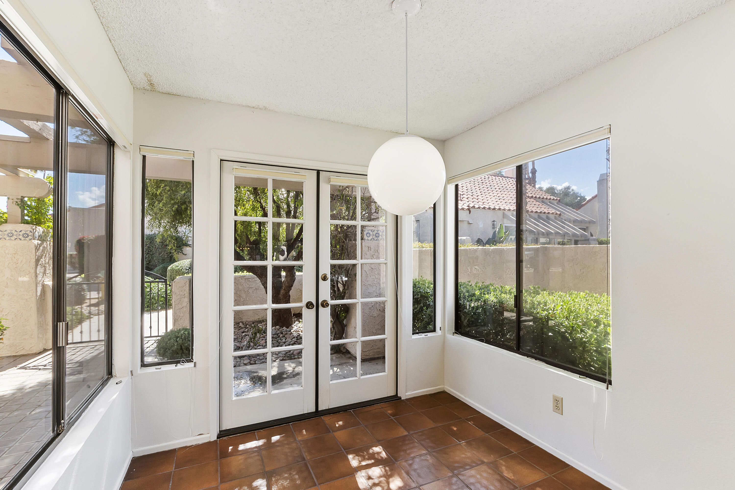 73472 Shadow Mountain Drive Palm Desert, CA 92260 - Photo 14 of 35 a view of a big room with windows