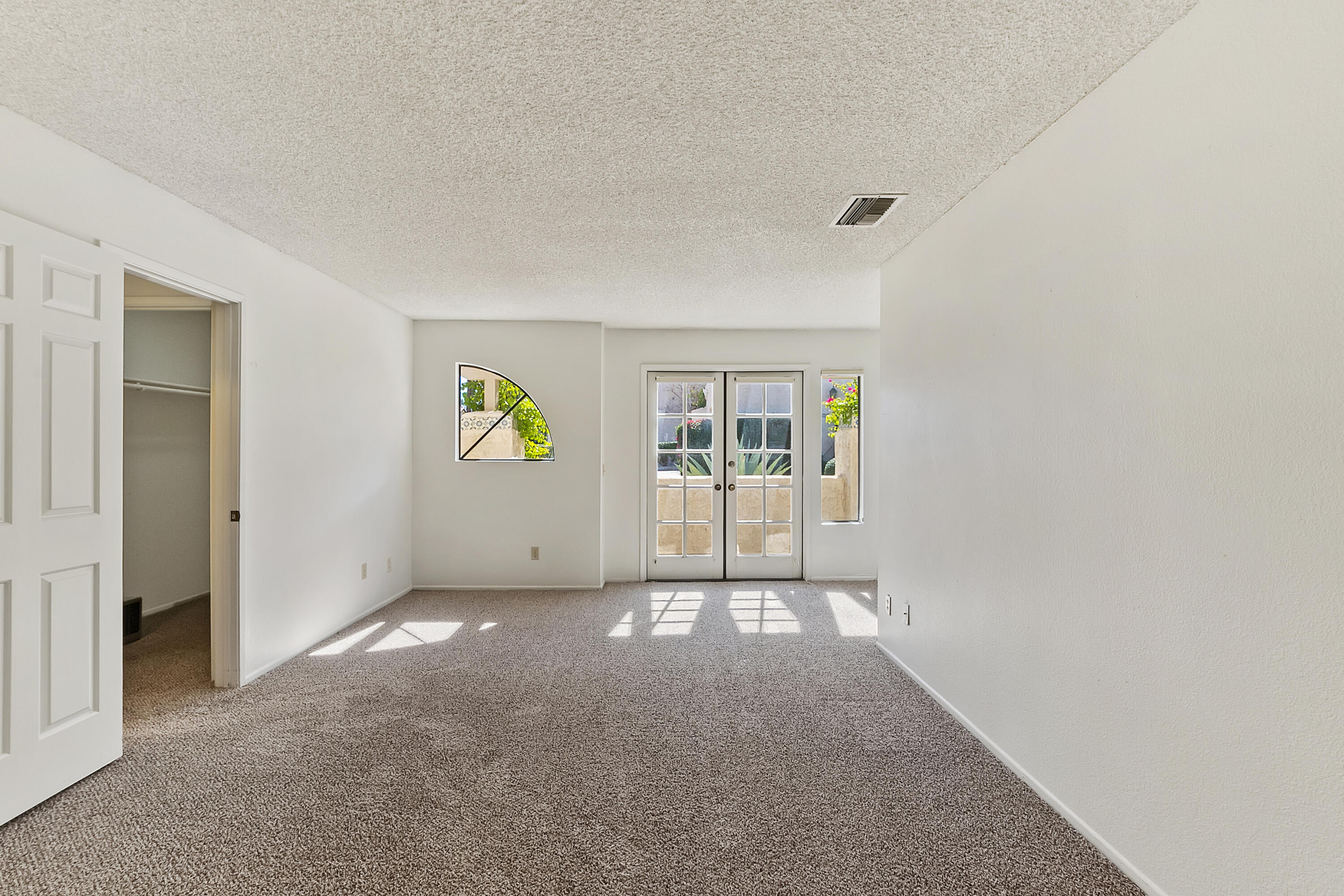 73472 Shadow Mountain Drive Palm Desert, CA 92260 - Photo 21 of 35 a view of an empty room with a window