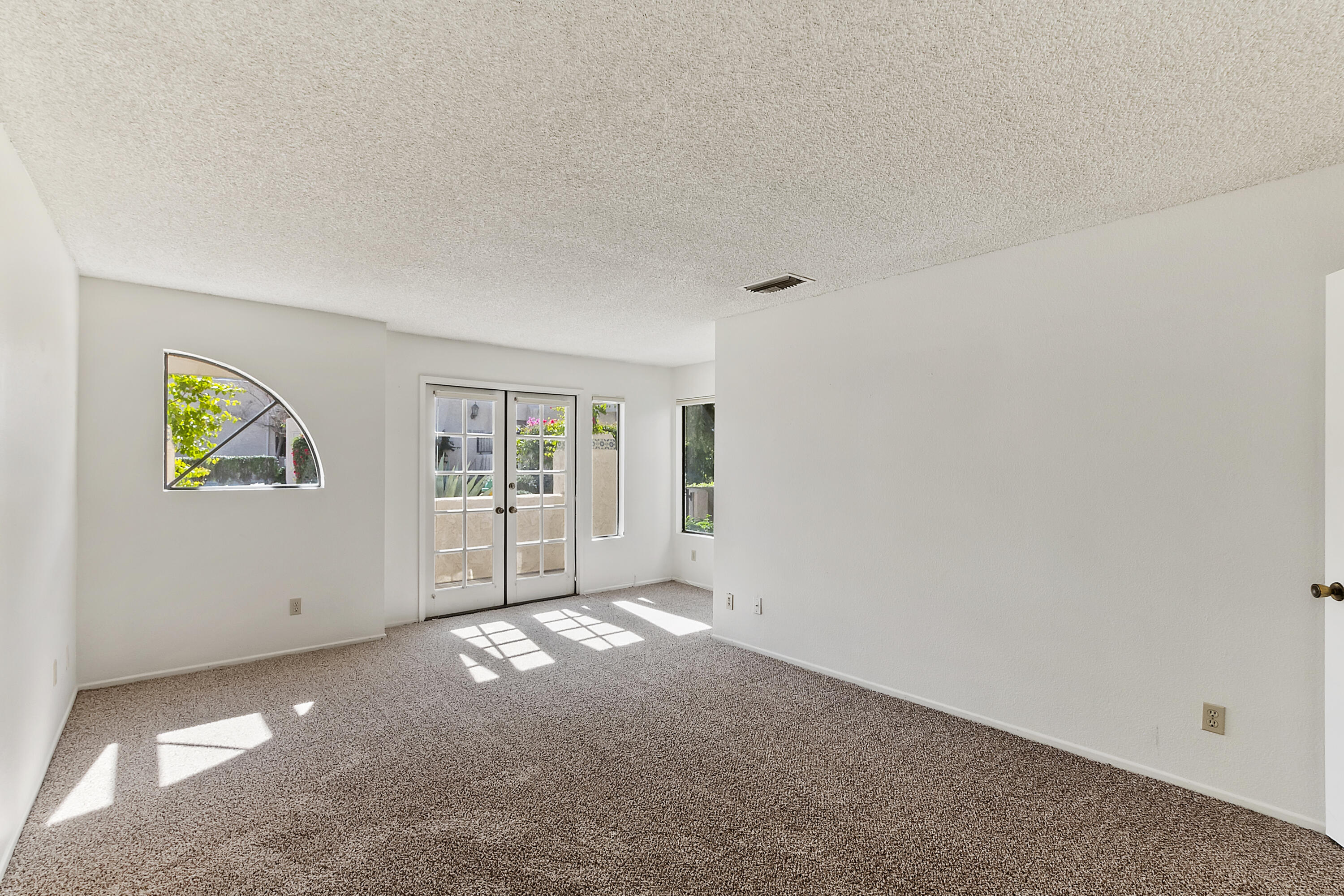 73472 Shadow Mountain Drive Palm Desert, CA 92260 - Photo 22 of 35 a view of an empty room with a window