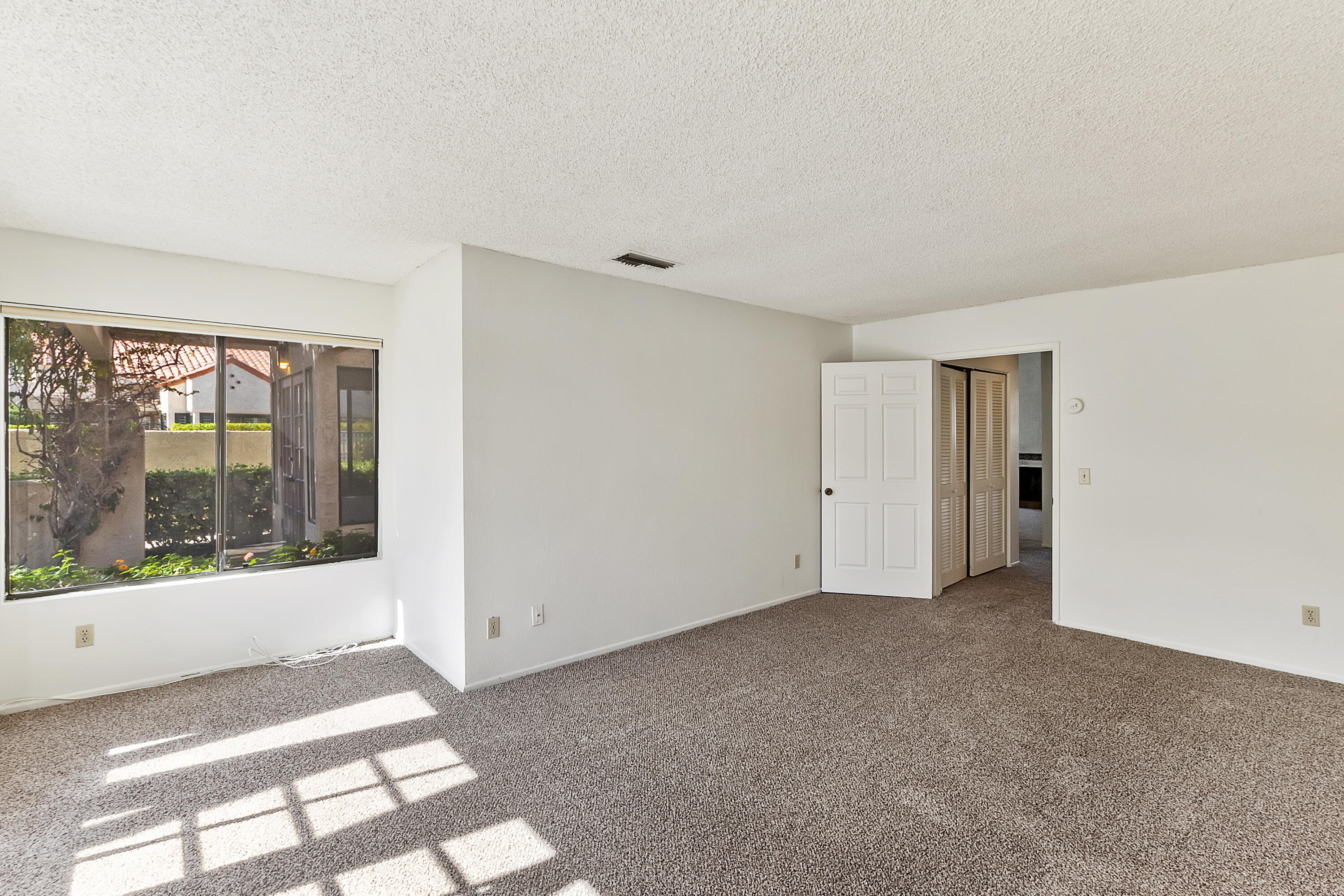 73472 Shadow Mountain Drive Palm Desert, CA 92260 - Photo 23 of 35 a view of an empty room with a window