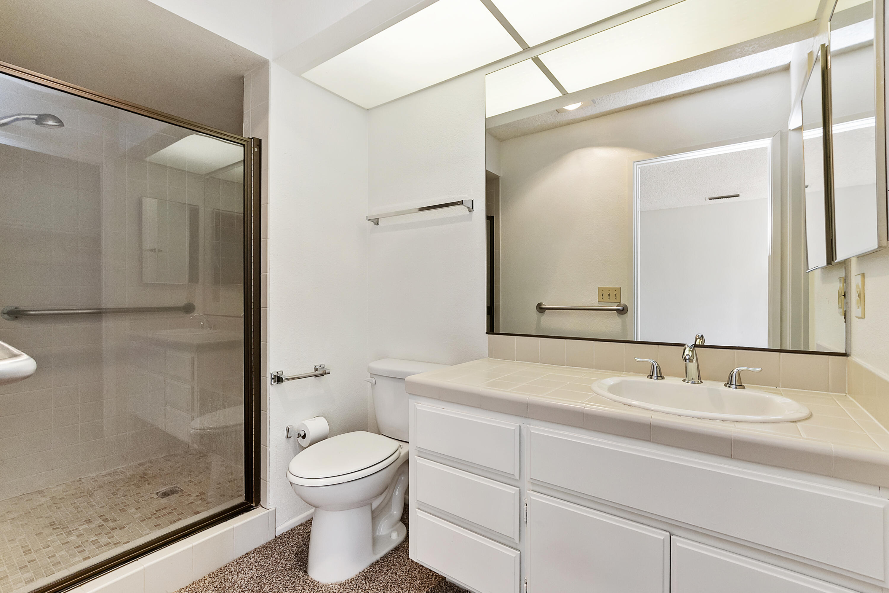 73472 Shadow Mountain Drive Palm Desert, CA 92260 - Photo 24 of 35 a bathroom with a sink a toilet and shower