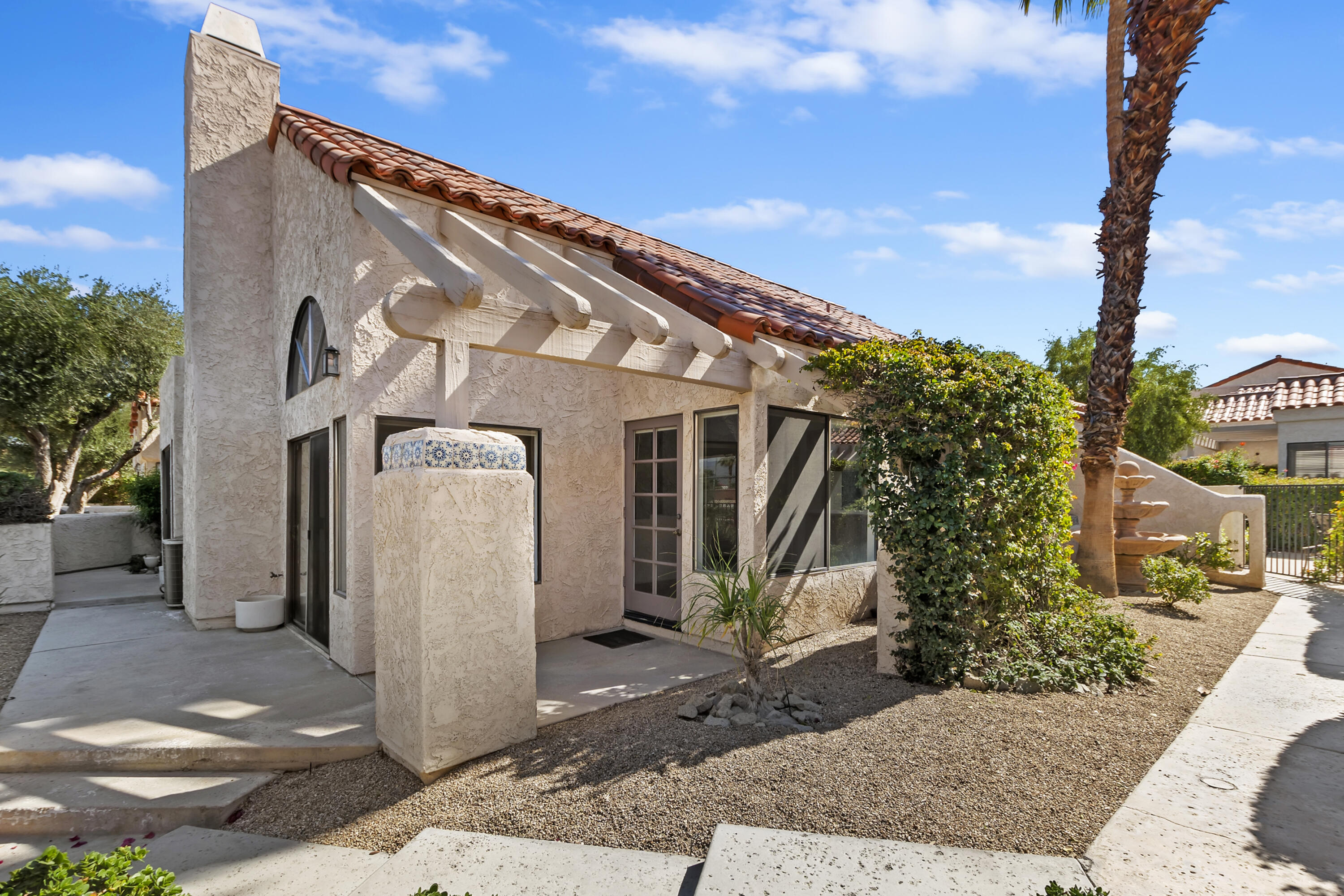 73472 Shadow Mountain Drive Palm Desert, CA 92260 - Photo 26 of 35 a front view of a house with garden