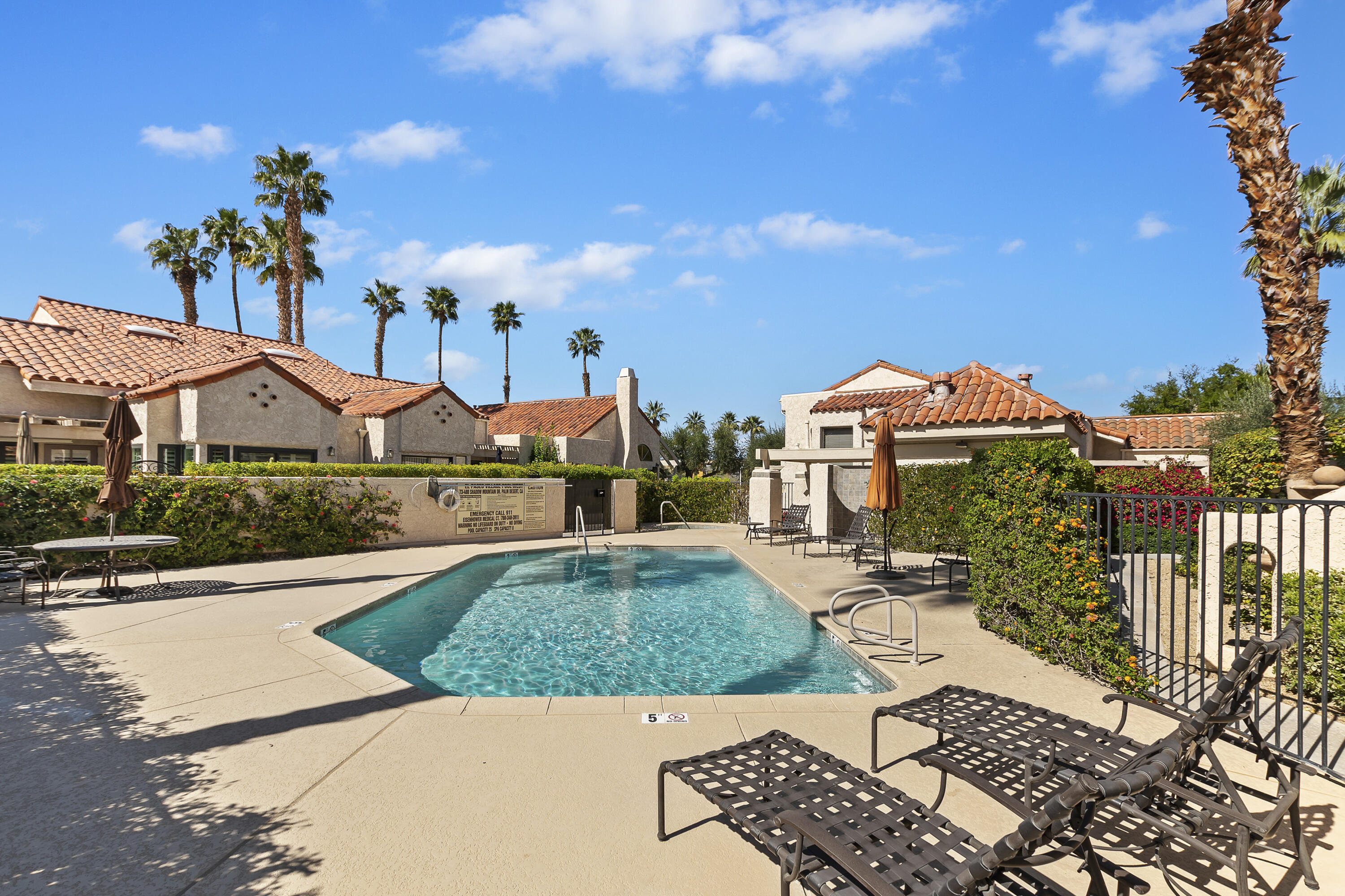 73472 Shadow Mountain Drive Palm Desert, CA 92260 - Photo 31 of 35 a front view of a house with garden