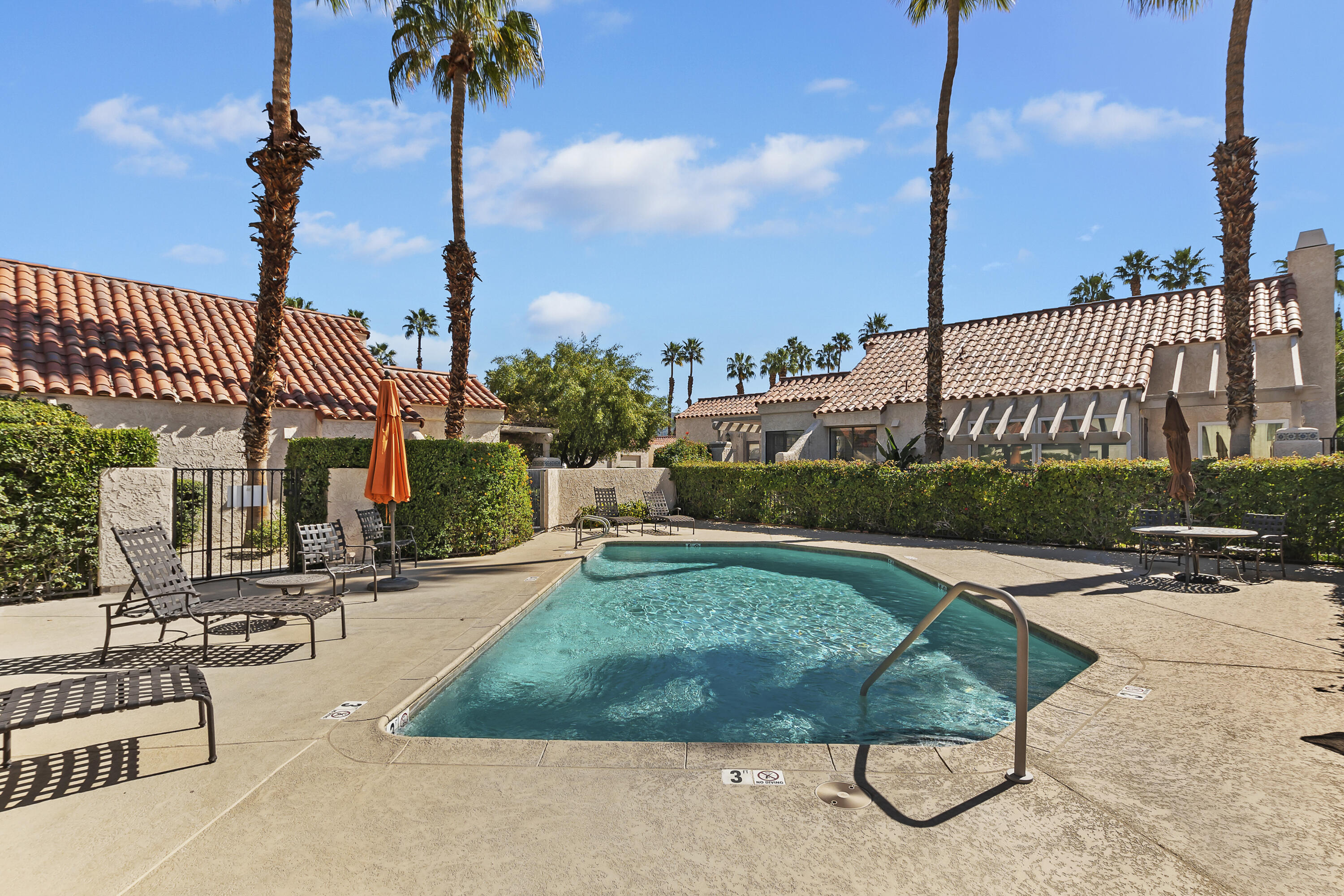73472 Shadow Mountain Drive Palm Desert, CA 92260 - Photo 32 of 35 a view of a swimming pool and a bench