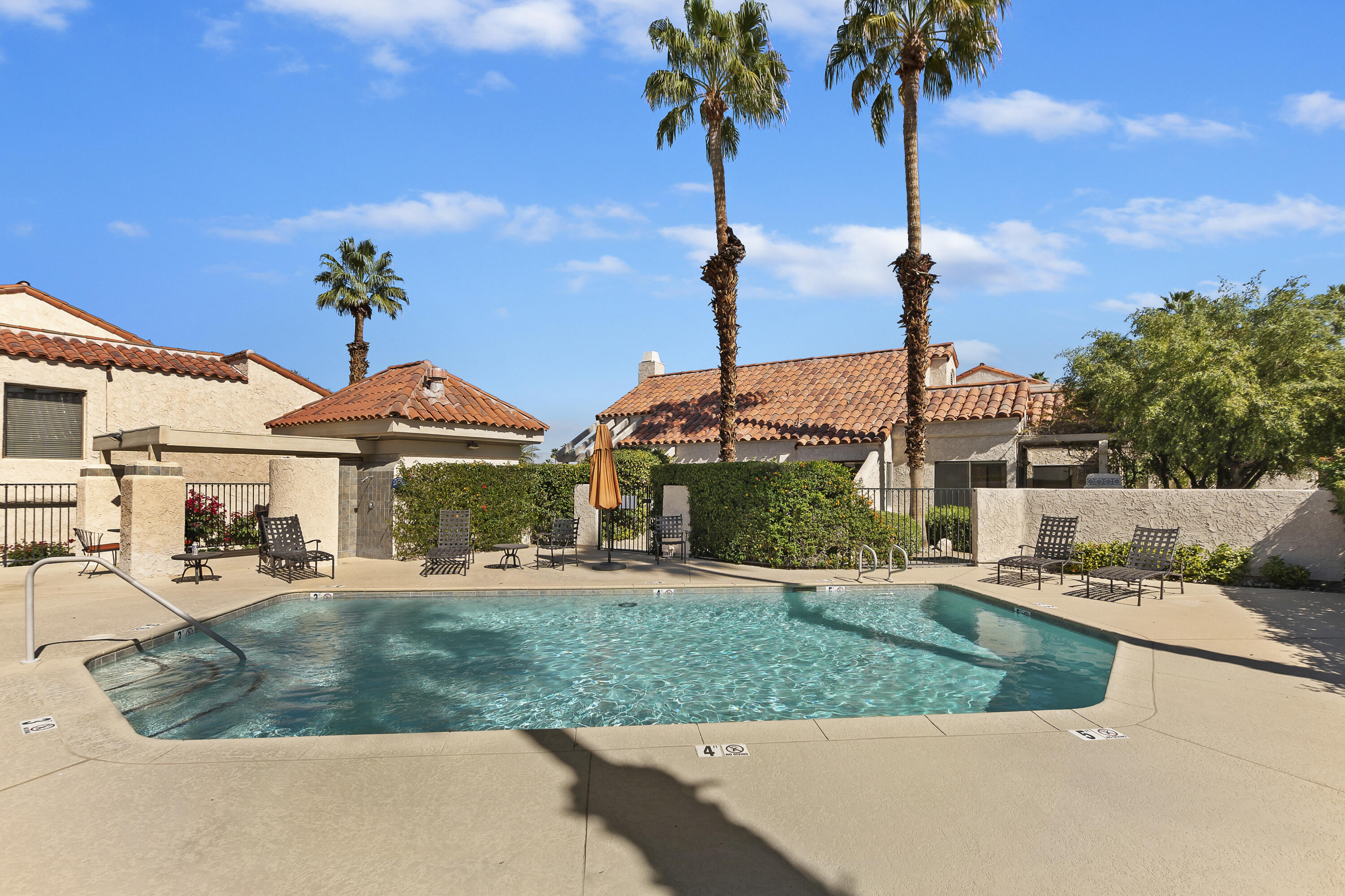 73472 Shadow Mountain Drive Palm Desert, CA 92260 - Photo 33 of 35 a view of a house with a garden and a tree