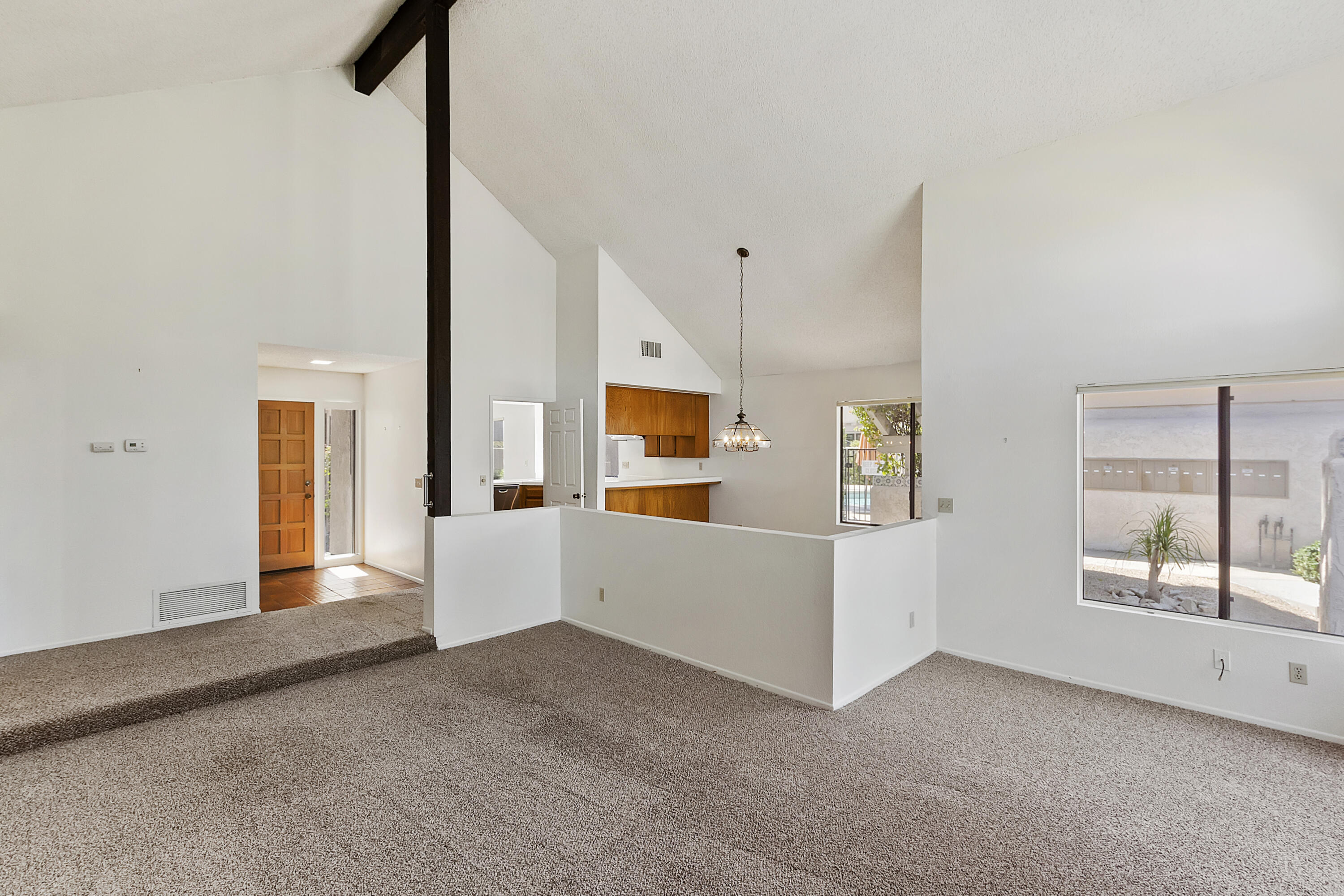 73472 Shadow Mountain Drive Palm Desert, CA 92260 - Photo 7 of 35 a view of an empty room with window and cabinet