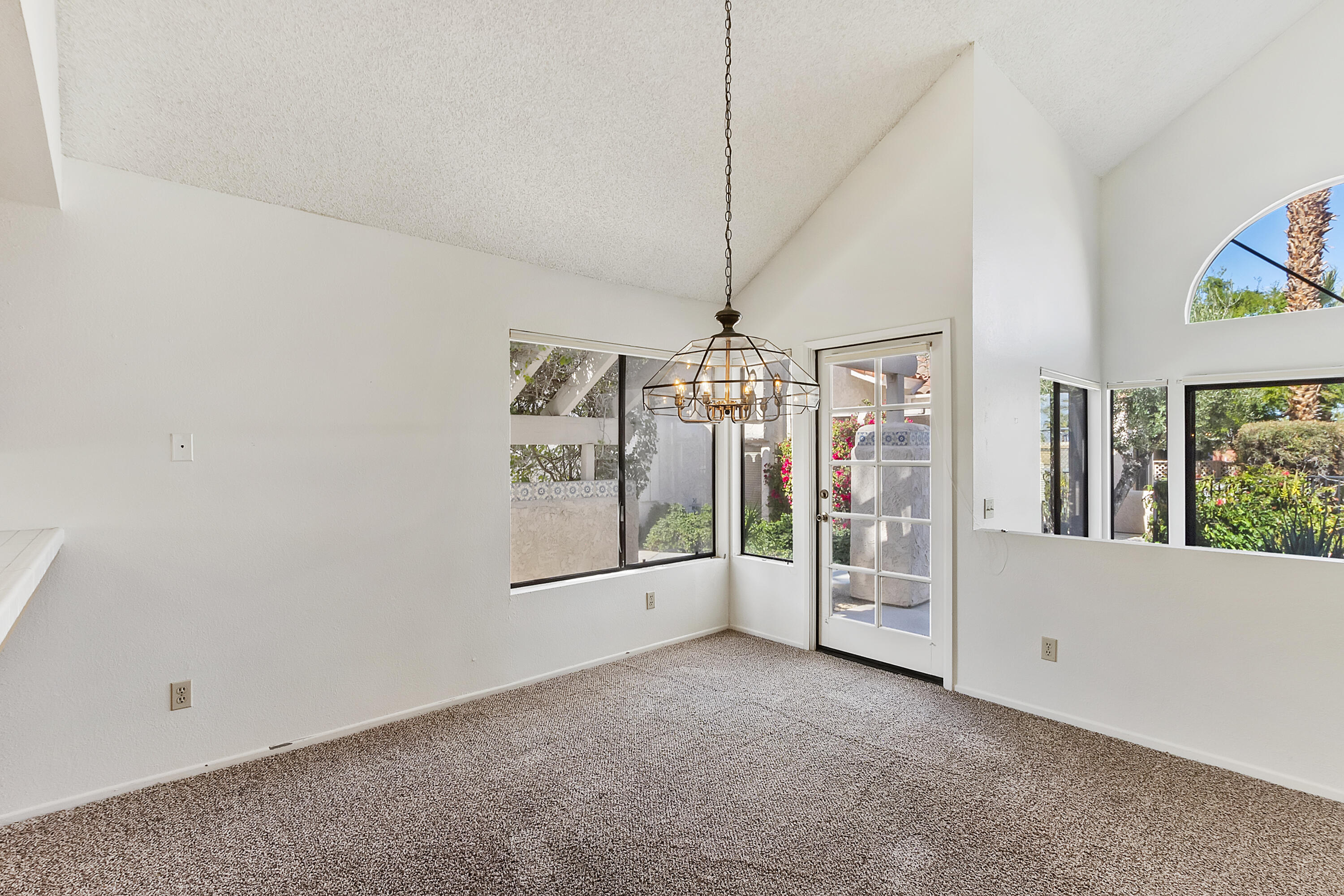 73472 Shadow Mountain Drive Palm Desert, CA 92260 - Photo 8 of 35 a view of empty room with floor to ceiling window