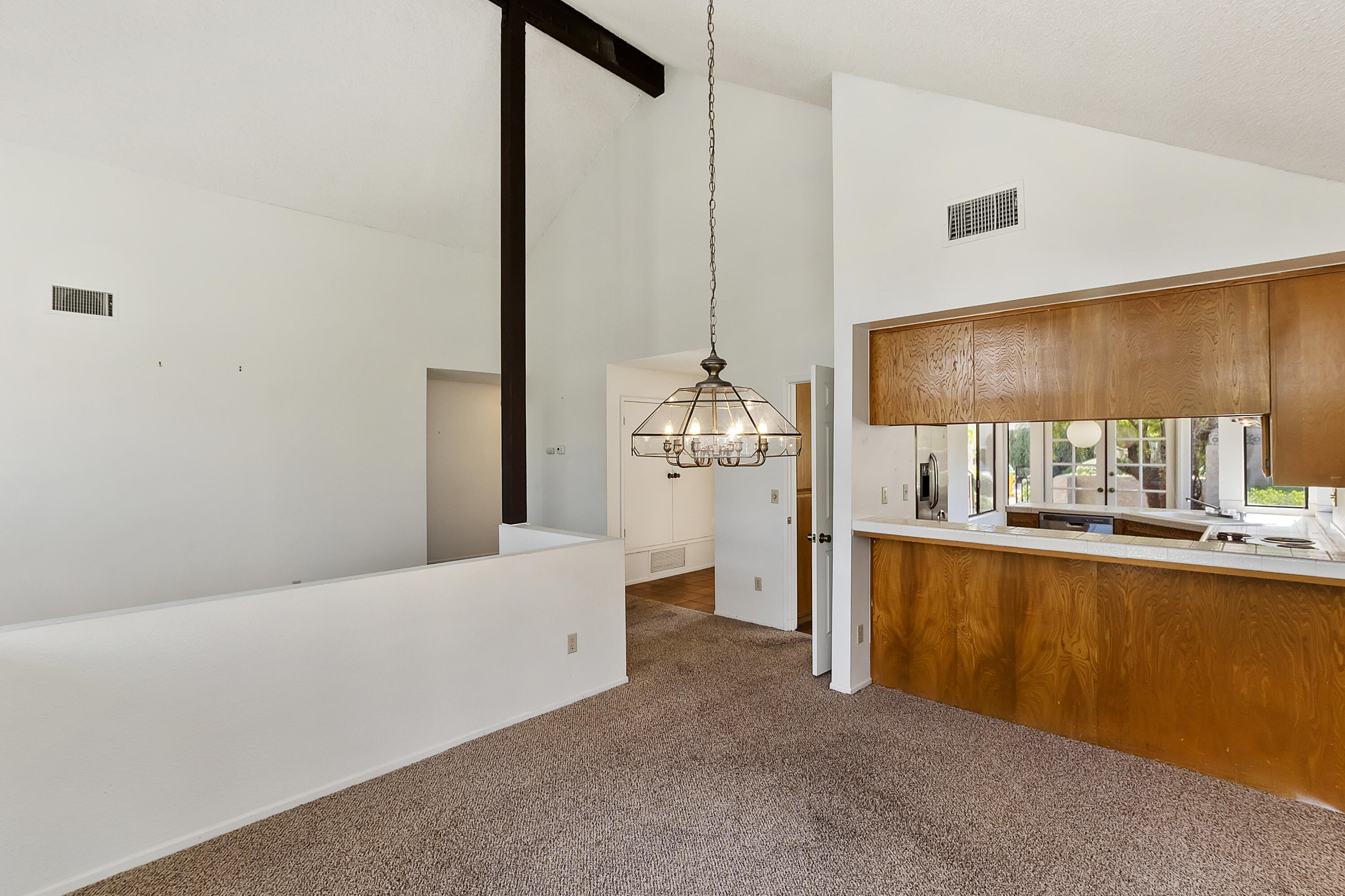 73472 Shadow Mountain Drive Palm Desert, CA 92260 - Photo 10 of 35 a kitchen with stainless steel appliances a refrigerator and a sink