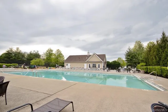 a view of a swimming pool and a yard