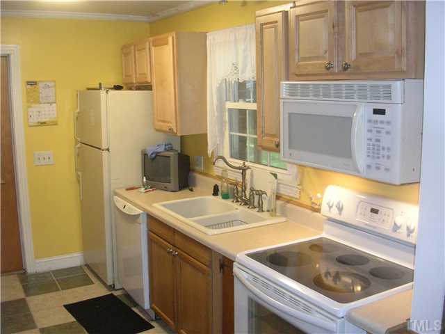301 Rolling Hills Road Roxboro, NC 27574 - Photo 2 of 16 a bathroom with a sink and a mirror