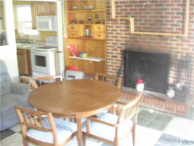 301 Rolling Hills Road Roxboro, NC 27574 - Photo 3 of 16 a room with table and chairs