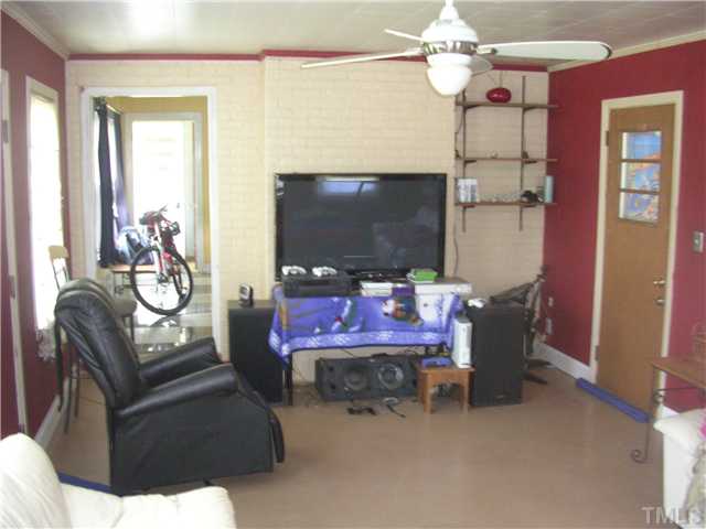 301 Rolling Hills Road Roxboro, NC 27574 - Photo 4 of 16 a view of a livingroom with furniture and a chandelier