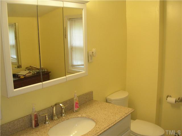 301 Rolling Hills Road Roxboro, NC 27574 - Photo 6 of 16 a bathroom with a sink and a mirror