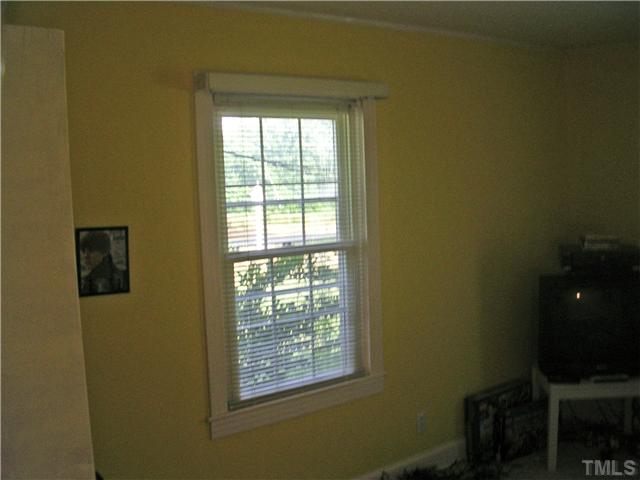 301 Rolling Hills Road Roxboro, NC 27574 - Photo 7 of 16 a view of an empty room with a window