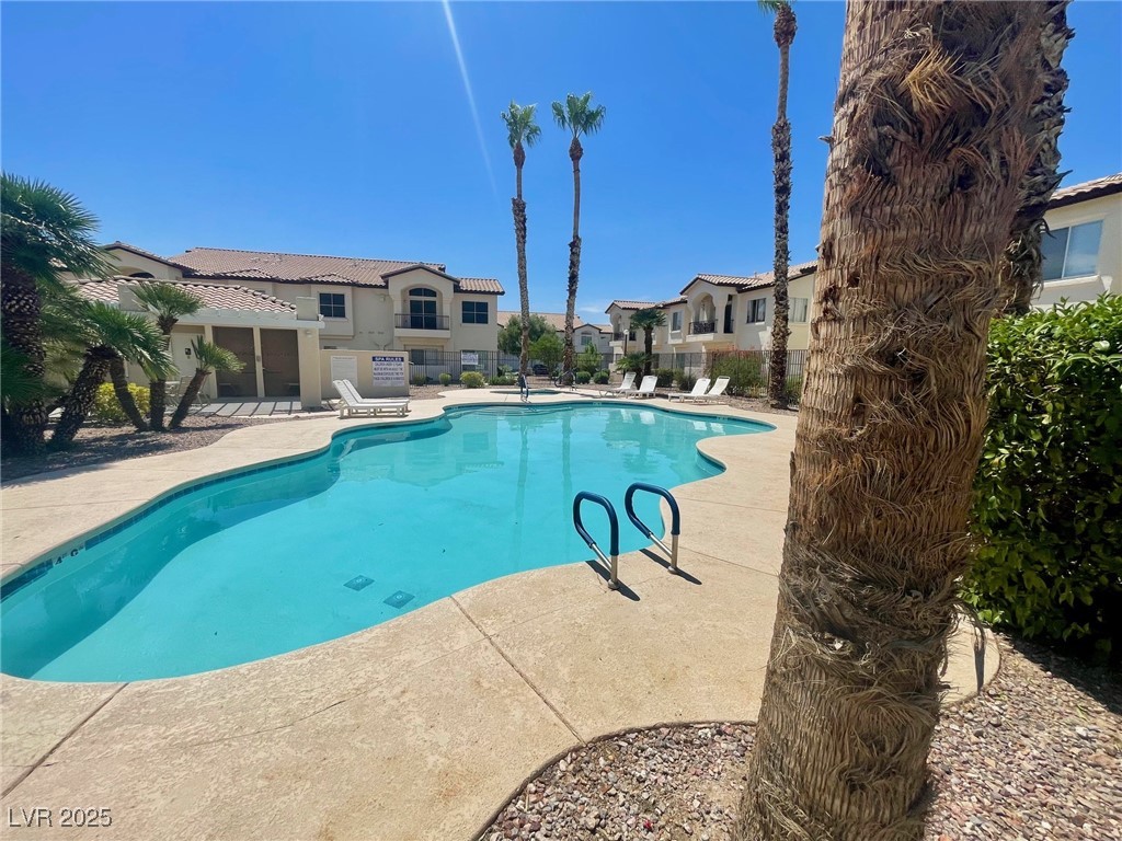4810 Grey Wolf Lane, Unit 101 Las Vegas, NV 89149 - Photo 4 of 7 Community pool featuring a patio area