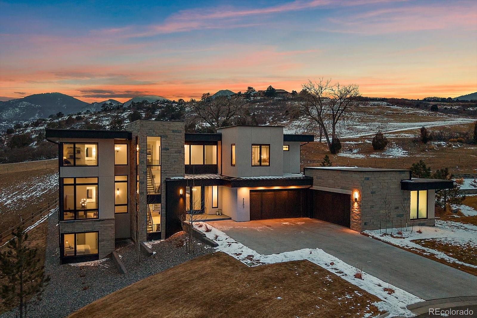5263 Creation Rock Trail Morrison, CO 80465 - Photo 1 of 50 a front view of a house with a yard