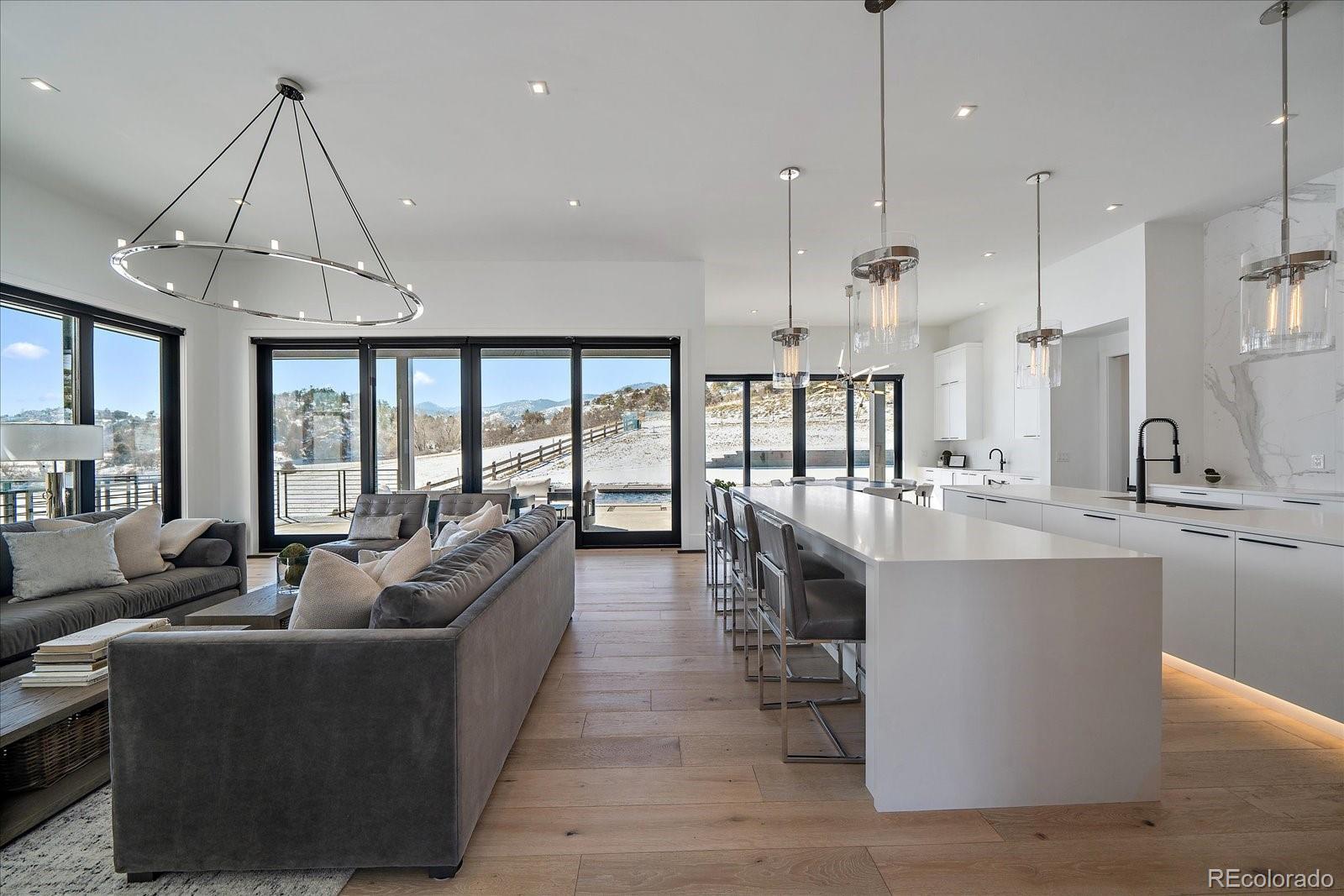 5263 Creation Rock Trail Morrison, CO 80465 - Photo 11 of 50 a large kitchen with kitchen island a large island in it