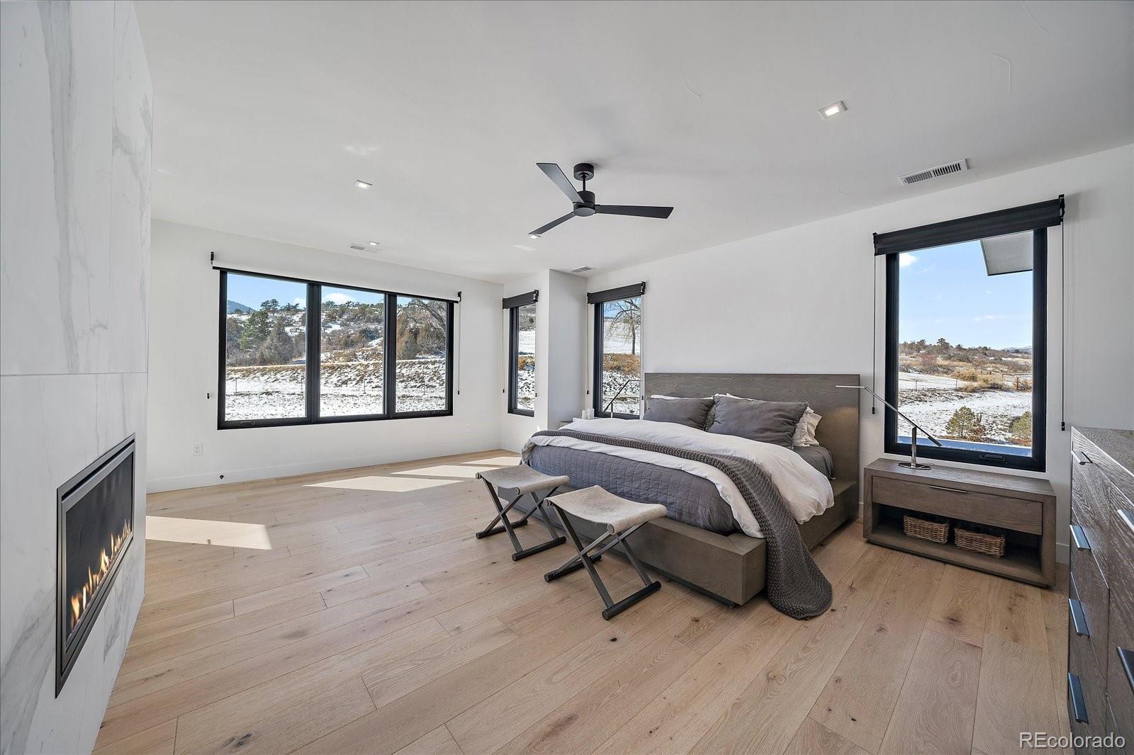 5263 Creation Rock Trail Morrison, CO 80465 - Photo 29 of 50 a bedroom with a bed and a window