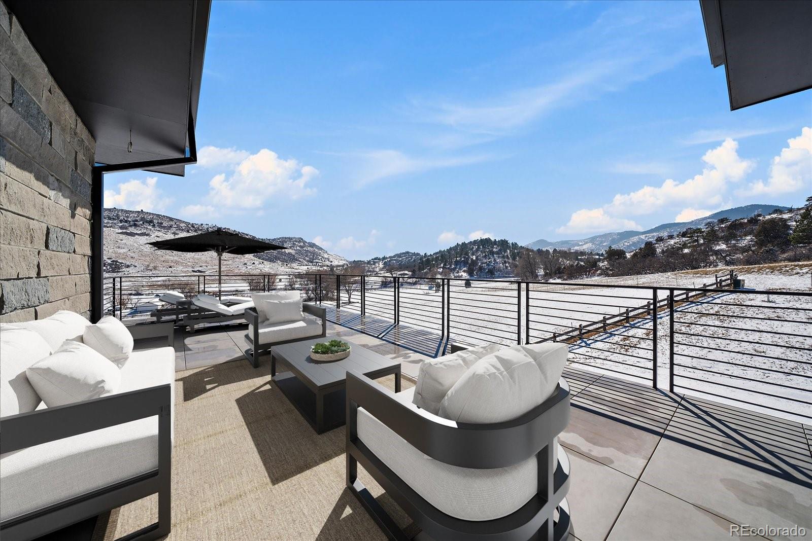 5263 Creation Rock Trail Morrison, CO 80465 - Photo 33 of 50 a view of a balcony with chairs