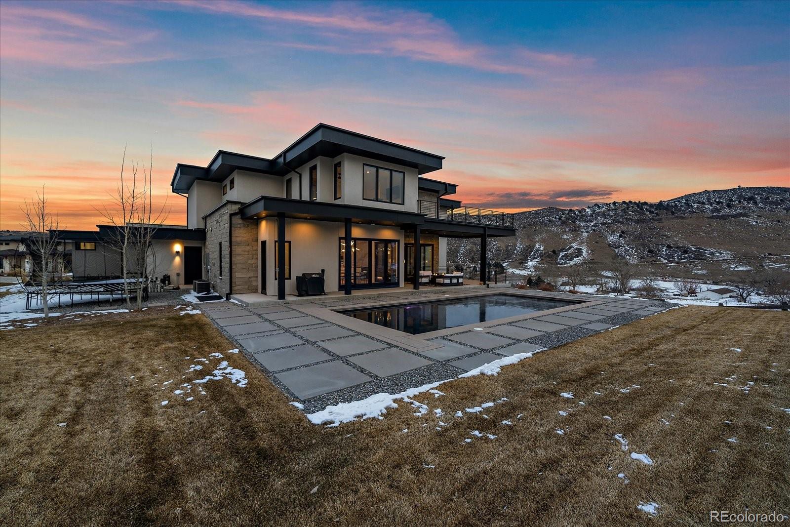 5263 Creation Rock Trail Morrison, CO 80465 - Photo 7 of 50 a front view of a house with a yard