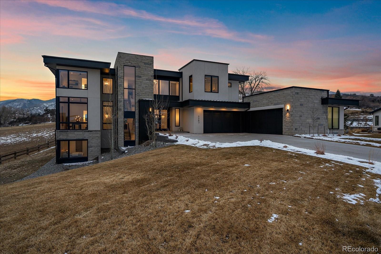 5263 Creation Rock Trail Morrison, CO 80465 - Photo 8 of 50 a front view of a house with a yard