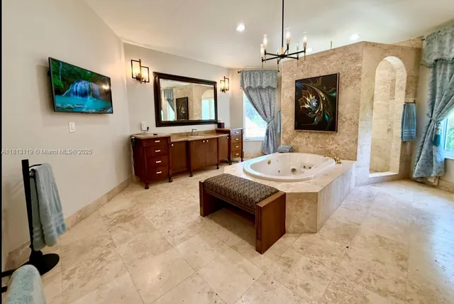 a bedroom with a large bed and a large window