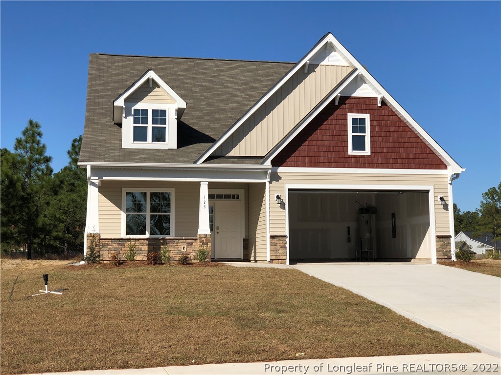 125 Sandy Springs Road Aberdeen, NC 28315 - Photo 1 of 7 a front view of a house with a yard