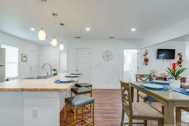 a view kitchen with a sink and a mirror
