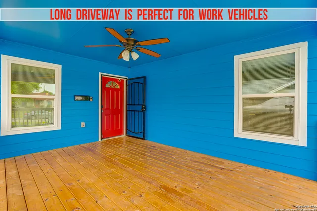 a view of a big room with windows