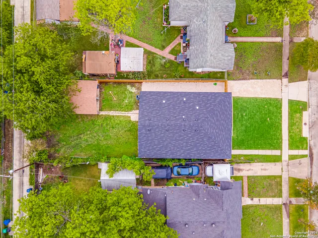 an aerial view of house with yard swimming pool and outdoor seating