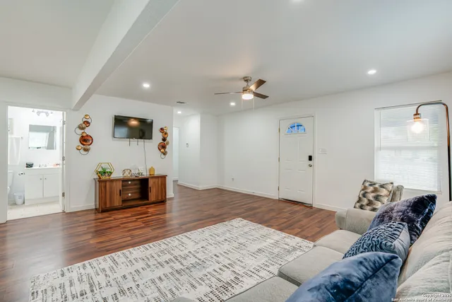 a view of a dining room with furniture and wooden floor