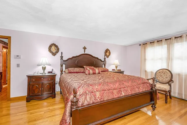 a bedroom with a bed and a table