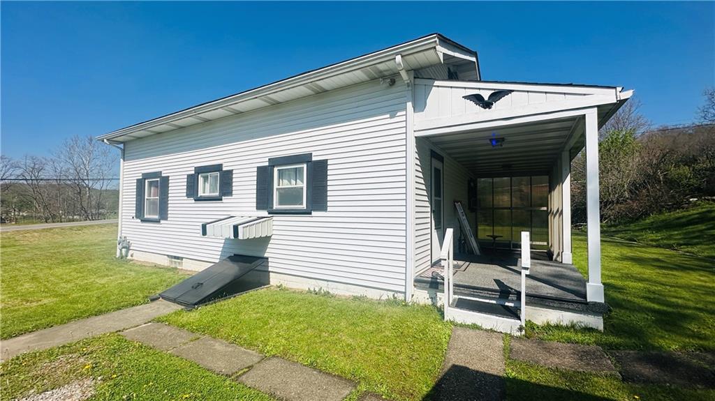 708 Lardintown Road Tarentum, PA 15084 - Photo 6 of 47 Covered and enclosed 14x7.5 foot patio. Bilco door for easy access to basement.