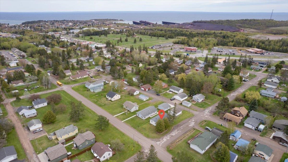 1632 9th Avenue Two Harbors, MN 55616 - Photo 18 of 21 Aerial overview of property's location featuring a nearby body of water and nearby suburban area