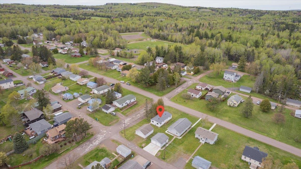 1632 9th Avenue Two Harbors, MN 55616 - Photo 21 of 21 Aerial overview of property's location featuring a forest and nearby suburban area