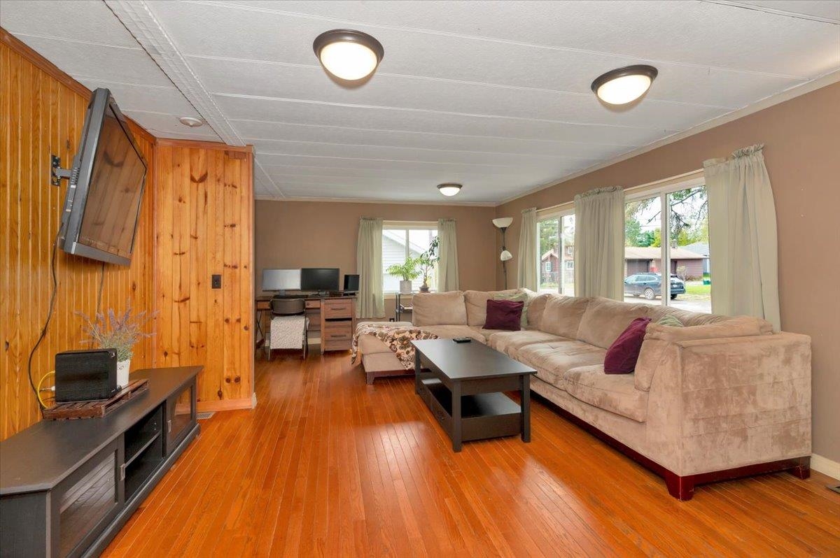 1632 9th Avenue Two Harbors, MN 55616 - Photo 3 of 21 Living area featuring light wood-style flooring and baseboards