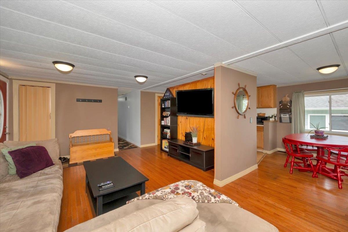 1632 9th Avenue Two Harbors, MN 55616 - Photo 4 of 21 Living area featuring light wood-type flooring and baseboards