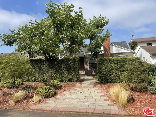 a view of a backyard of the house