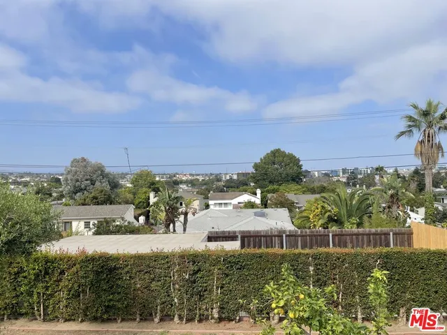 a view of a swimming pool and outdoor seating