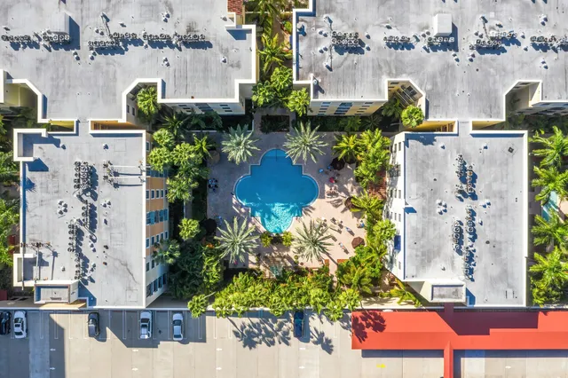 an aerial view of residential houses with outdoor space