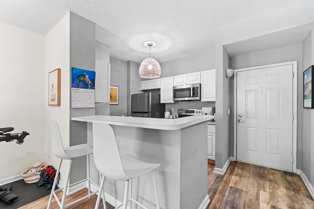 a kitchen with a sink cabinets and window