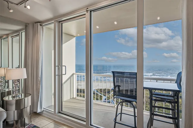 a view of a balcony with chairs