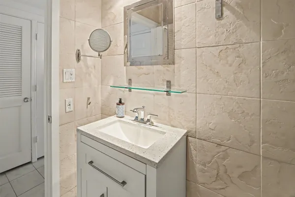 a bathroom with a sink and a mirror